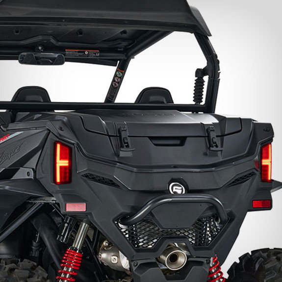 sxs_zforce-950-sport_fh-4 Rear view of a black zforce 950 sport off-road utility vehicle showcasing taillights, suspension springs, and spacious storage cargo area.
