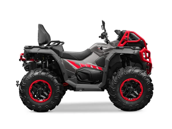 Side view of a black and red all-terrain vehicle (ATV) with large rugged tires, a backrest on the seat, and prominent front and rear bumpers.