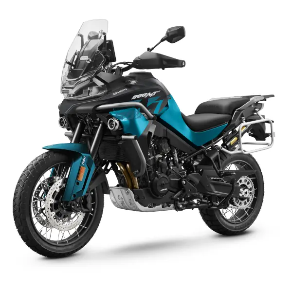 A blue and black CFMoto adventure motorbike with a windscreen, spoked wheels, dual front disc brakes, and a side luggage rack, viewed from the front-left angle.