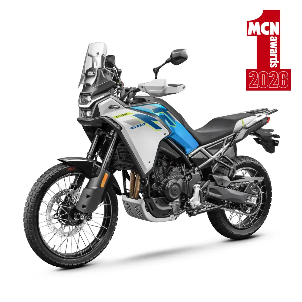 A blue and silver adventure motorbike from CFMoto Motorcycles is parked on a white background with a red “MCN Awards 2026” graphic in the top right corner.